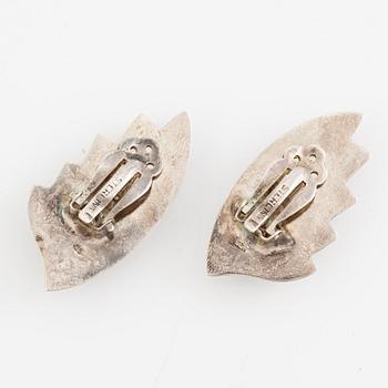 Earrings, silver, in the form of stylised leaves.