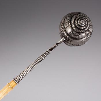 An 18th century parcel-gilt and bone ladle, unmarked.