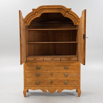 An oak veneered rococo cabinet, mid 18th Century.