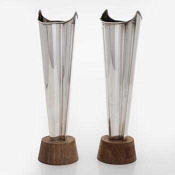 Tapio Wirkkala, two silver and teak 'Flame' vases, Kultakeskus, Hämeenlinna 1962 and 1964.