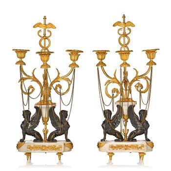 141. A pair of Louis XVI three lights Candelabra, Parisian works, in the manner of François Rémond, late 18th century.