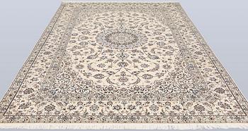 A Nain, part silk carpet, 305 x 207 cm.