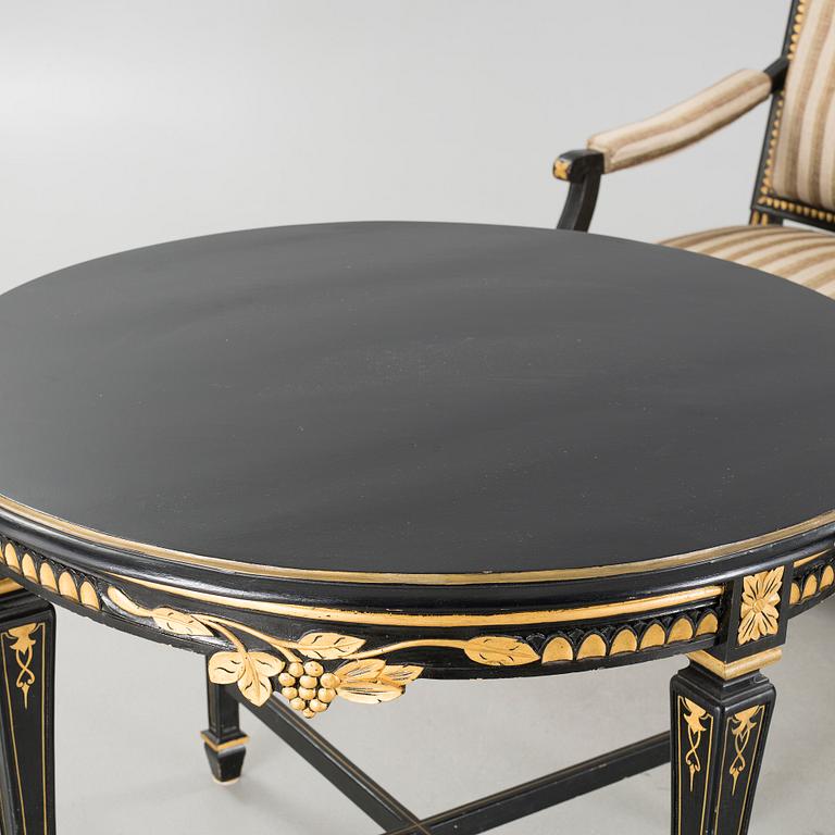 A gustavian style table and sofa, around the year 1900.