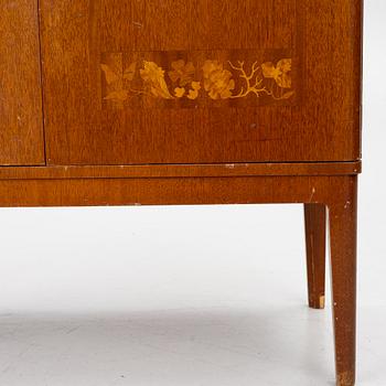 A Swedish Modern cabinet, 1940s.