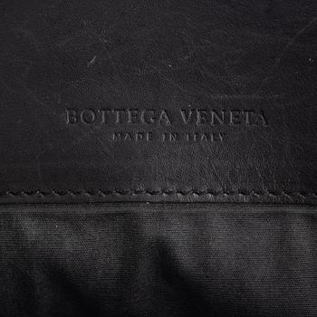 Bottega Veneta, a black leather briefcase.