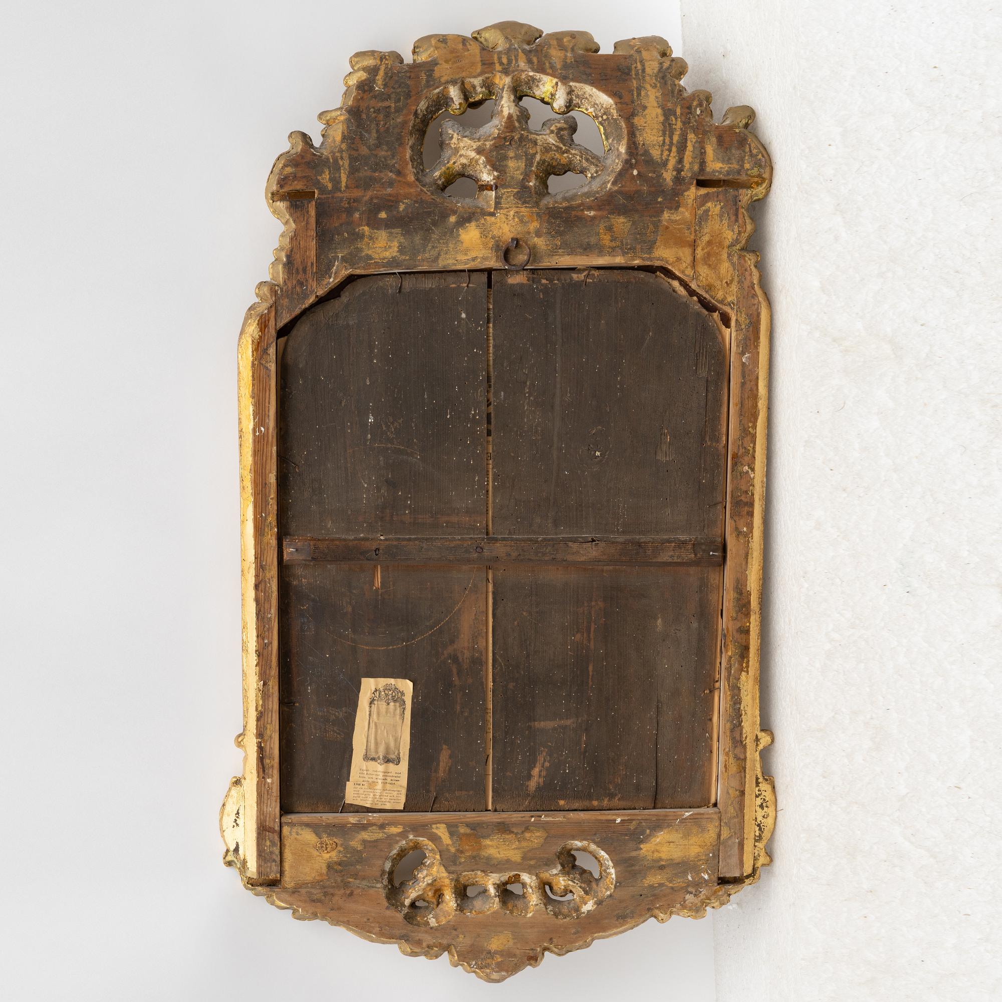 A Swedish rococo two-branch girandole mirror, Stockholm, later part 18th century.