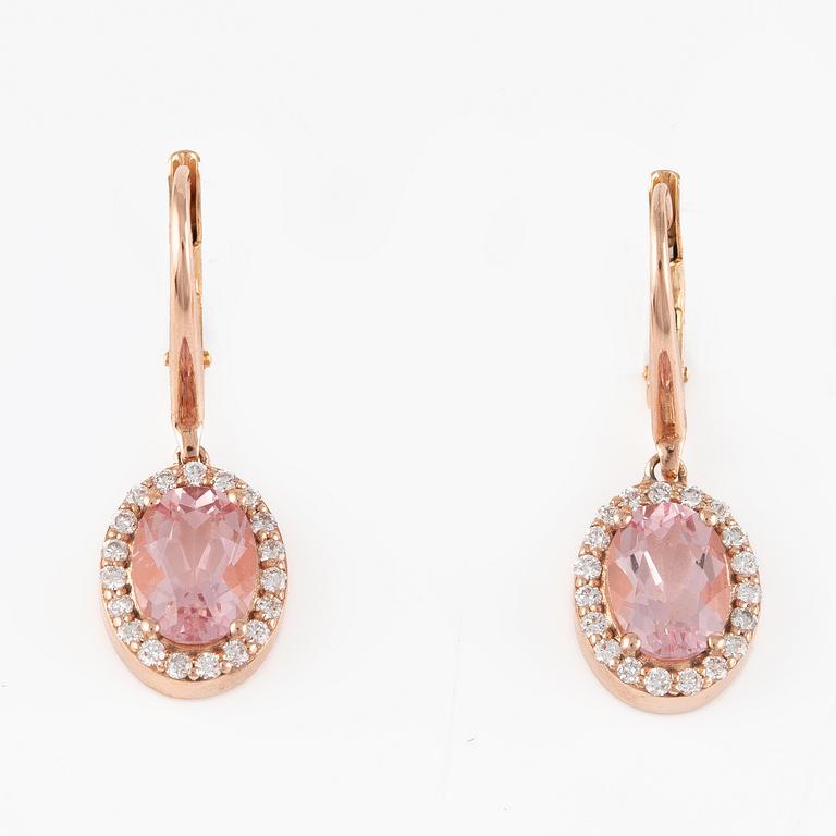 A pair of 14K gold earrings with faceted morganites and round brilliant-cut diamonds.