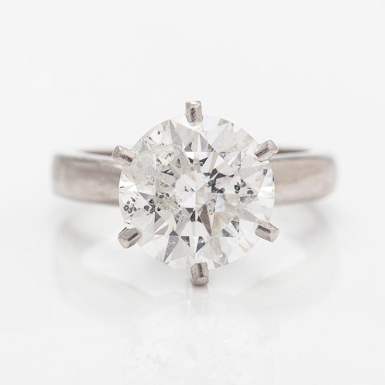 A platinum ring, with a brilliant-cut diamond approximately 3.10 ct. Domino Jewellery, Birmingham, England.