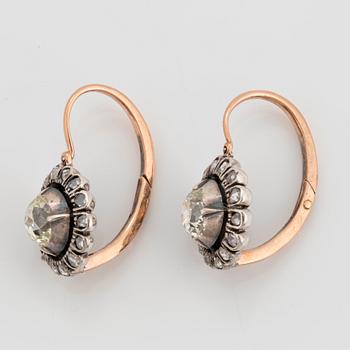 A pair of 9K gold and silver earrings set with old- and eight-cut diamonds.