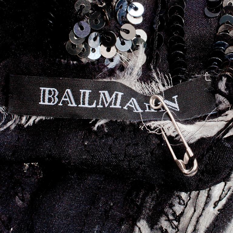 BALMAIN, a black and silver sequin dress.