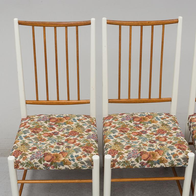Four '829' chairs by Karl Axel Adolfsson, Gemla with an additional table.