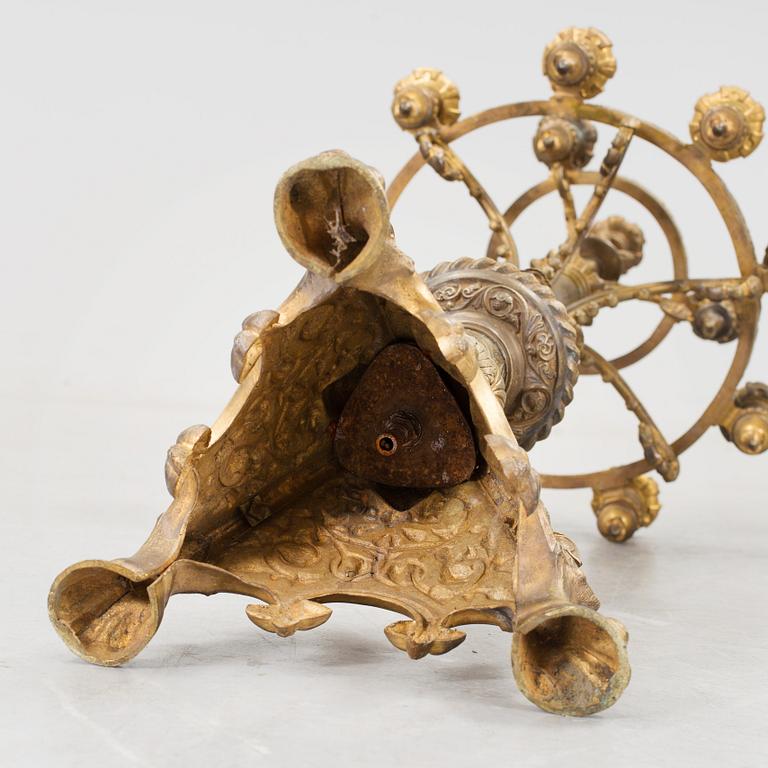 Two similar 19th century bronze candelabras.