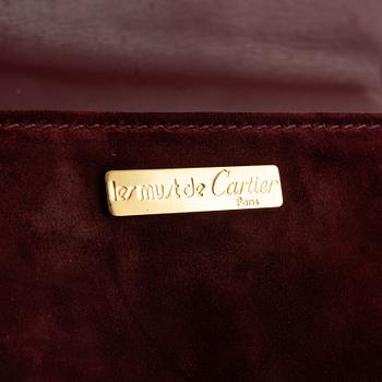 Cartier, A red suede vintage weekendbag.