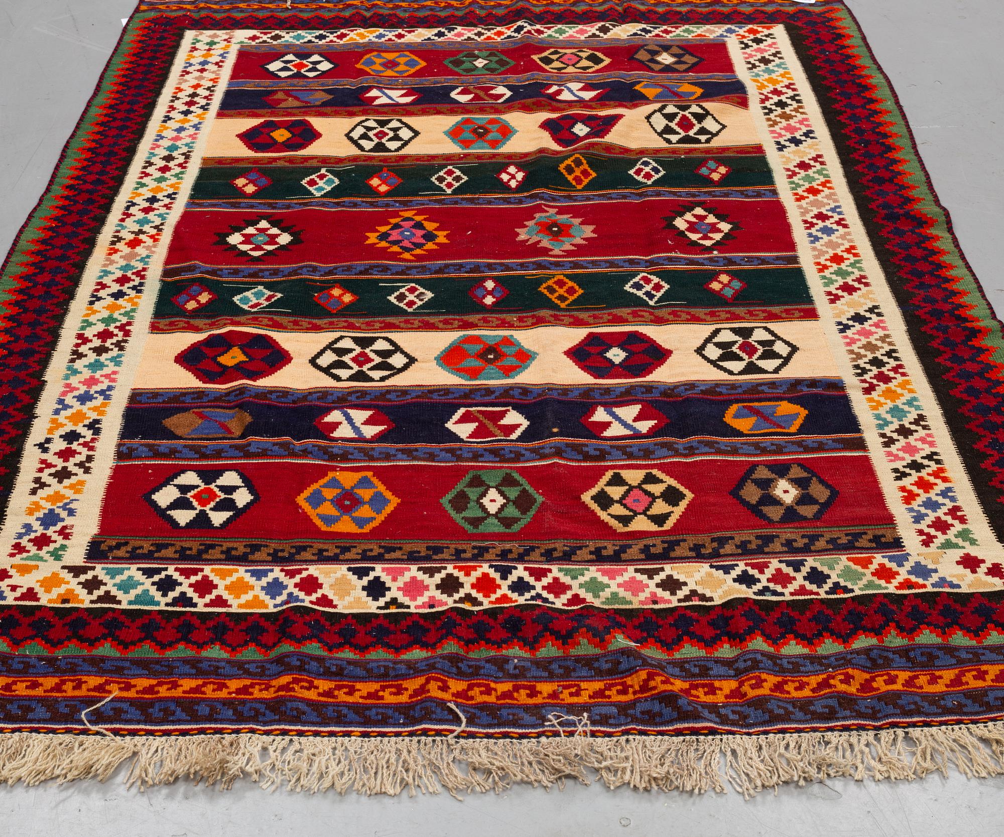 A CARPET, Persian kilim, ca 240 x 167 cm.