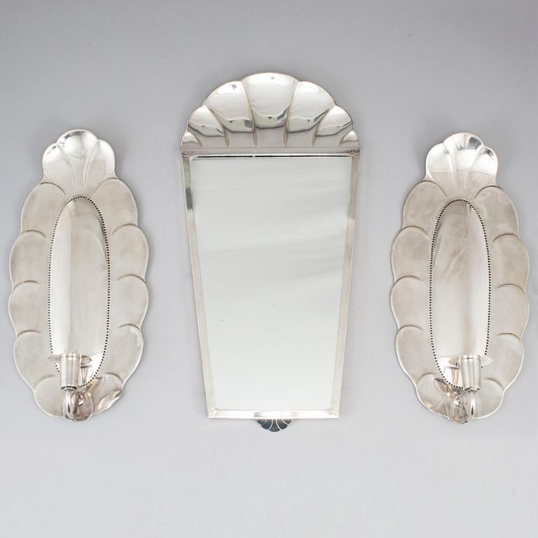 A mirror and a pair of wall lights, silver plate, GAB, early 20th century.