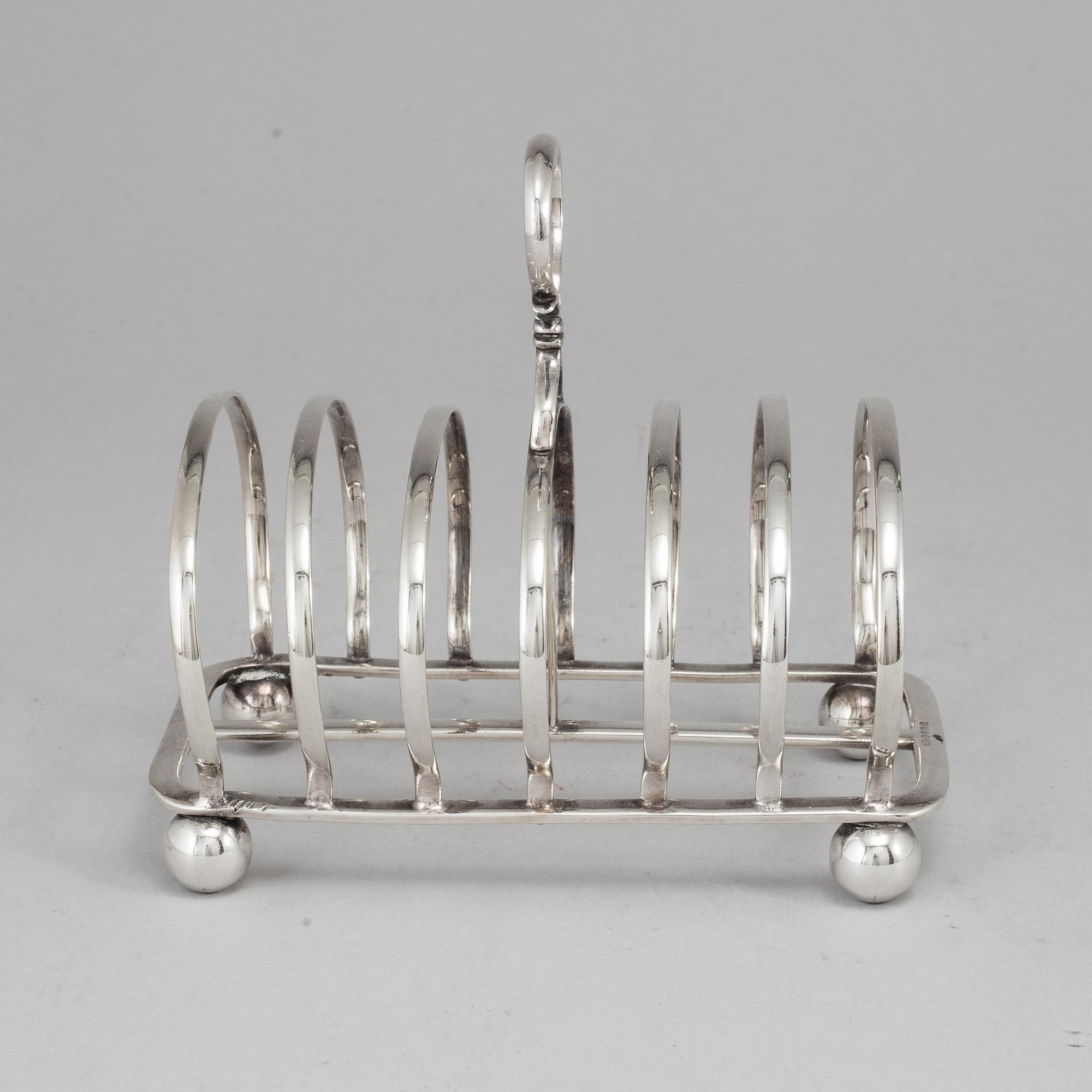 An English 20th century silver-plated toast rack, marked WH.