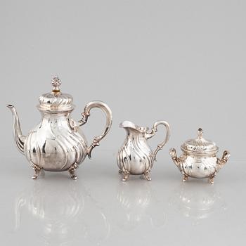 A German Silver Coffee Pot, Creamer and Sugar Bowl, mark of Wilhelm T Binder, Schwäbisch Gmünd, early 20th Century.