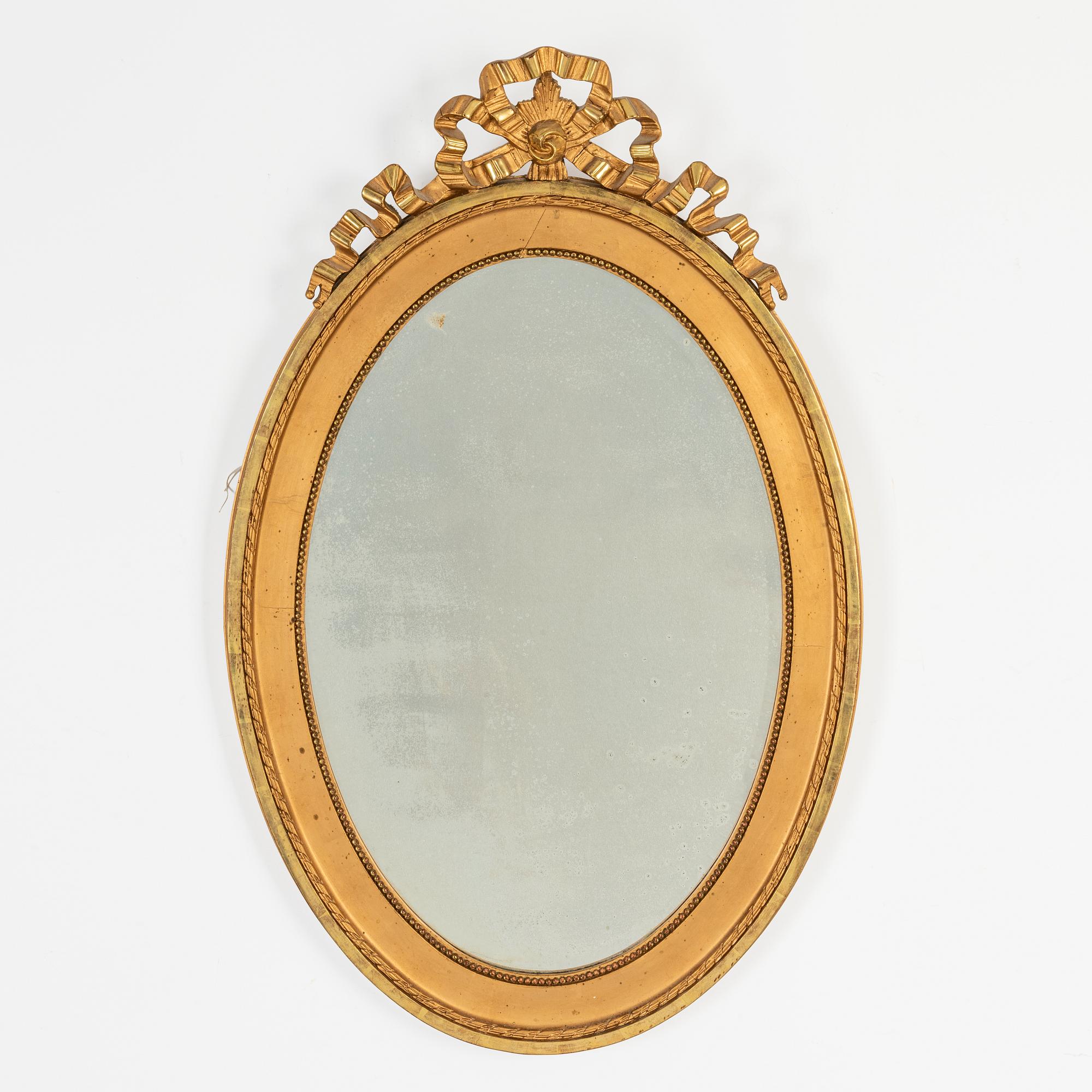 An oval Gustavian style mirror, early 20th Century.