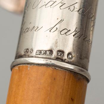 NINE WALKING STICKS, silver handles and a stick with plate handle, first half of the 20th century.