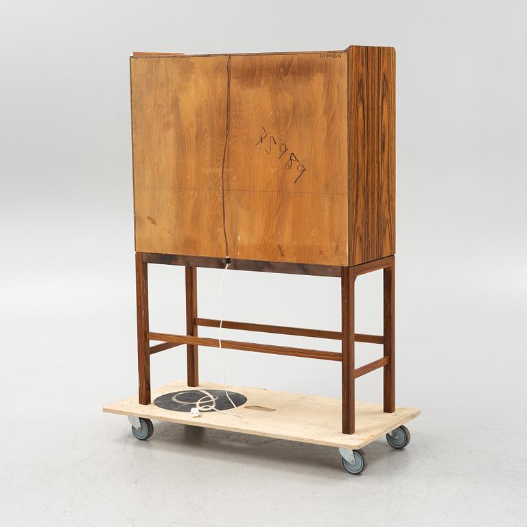 A mid 20th century bar cabinet.