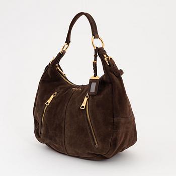 Prada, a brown suede handbag.