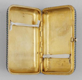A RUSSIAN SILVER-GILT AND ENAMEL CIGARETT-CASE, makers mark of Pavel Ovchinnikov, Moscow 1880's.
