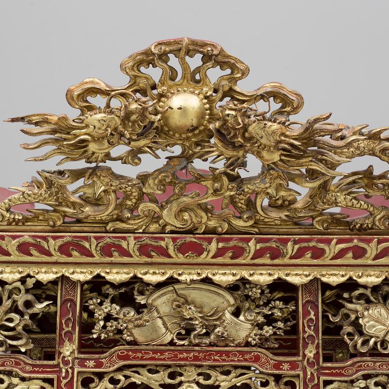 A Chinese red lacqured altar cabinet, late Qing dynasty/early 20th century.