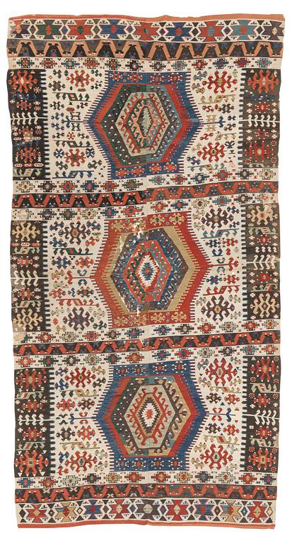 An antique Anatolian kilim, ca 324 x 169 cm.