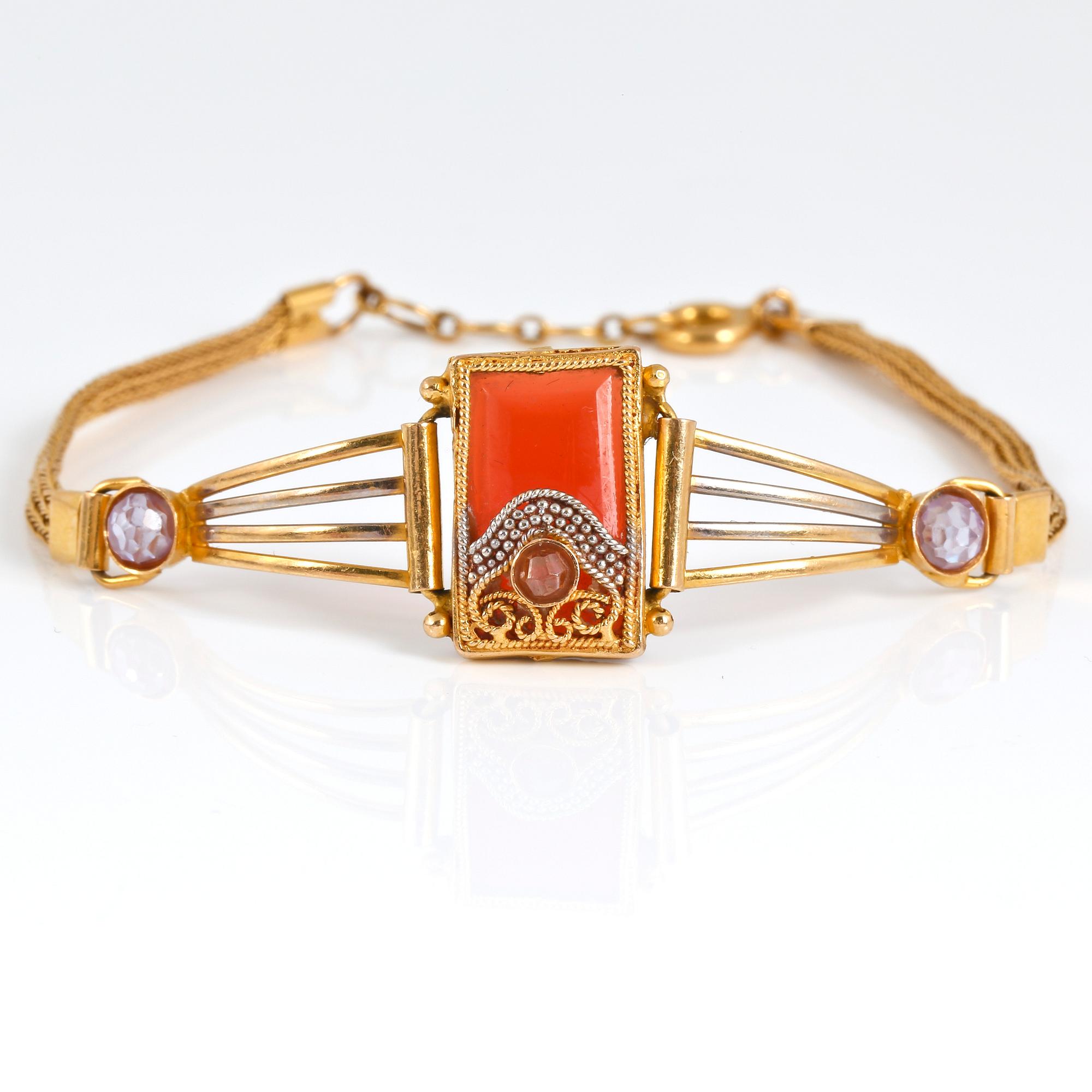 ARMBAND, 21K guld med orange och vita pastestenar. Vikt ca 8,57 g.