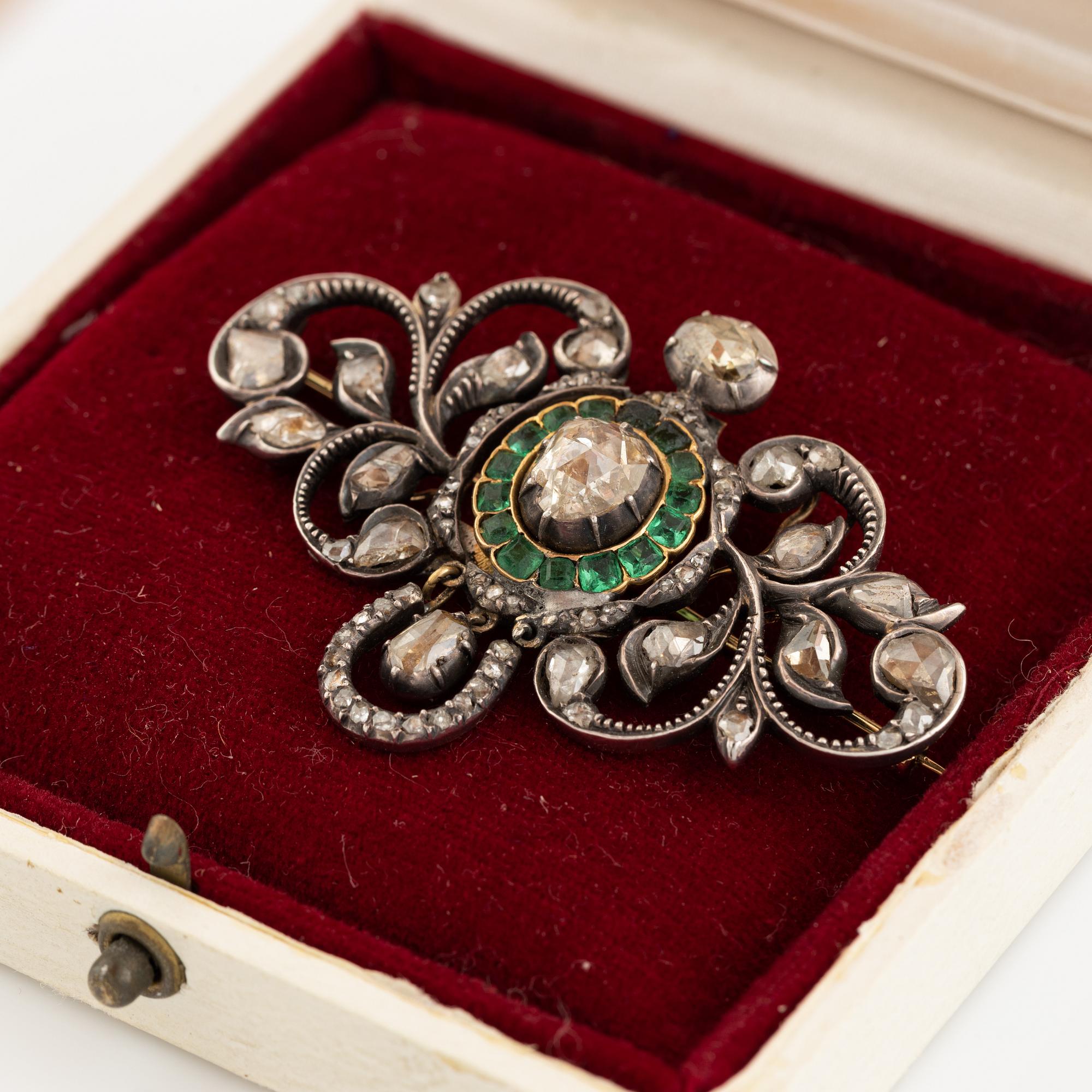 Gold and silver with rose cut diamond and emerald brooch.