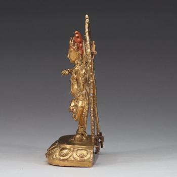 A gilt bronze figure of Kurukulla, presumably circa 1900.