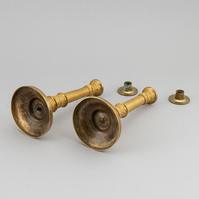 An early 19th Century pair of bronze empire candle sticks.