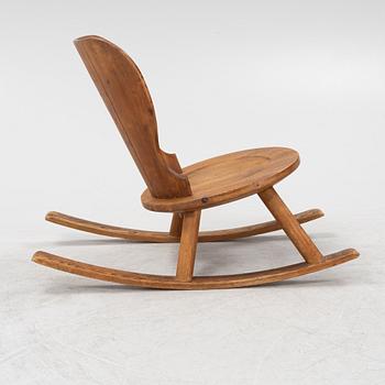 A 1940's pinewood rocking chair.