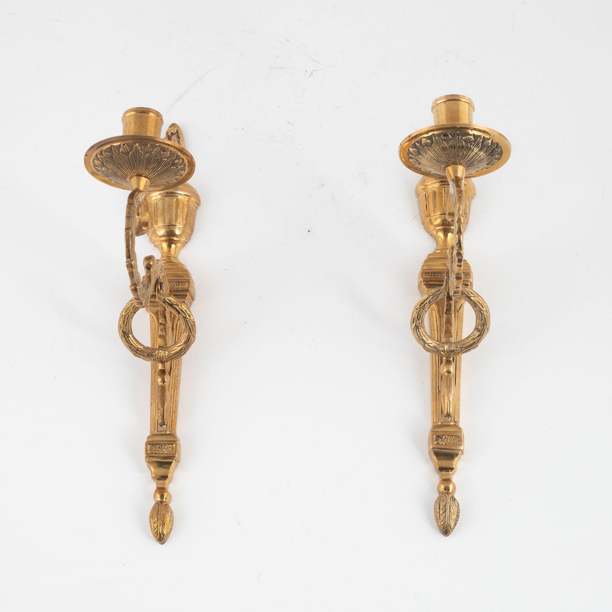 A pair of 'Törne' brass one-light wall ligths from IKEA's 18th Century collection.