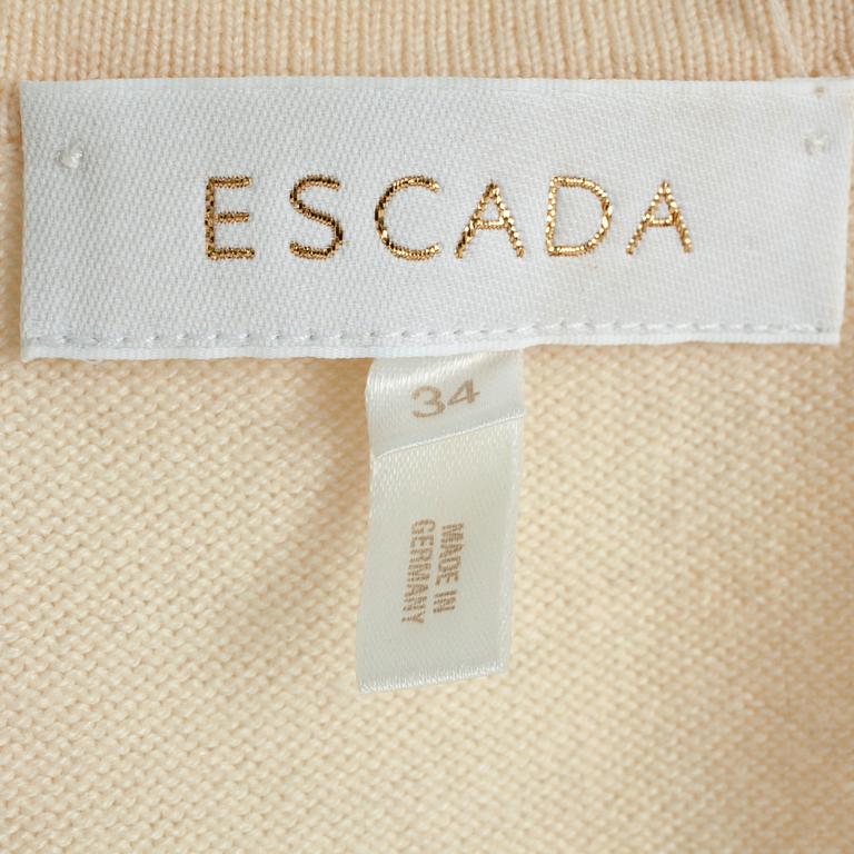 ESCADA, a creme colored wool and cashmere blend cardigan with sequin embellishment.