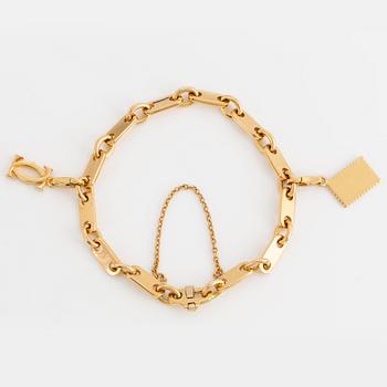 Cartier 18K gold charm bracelet.