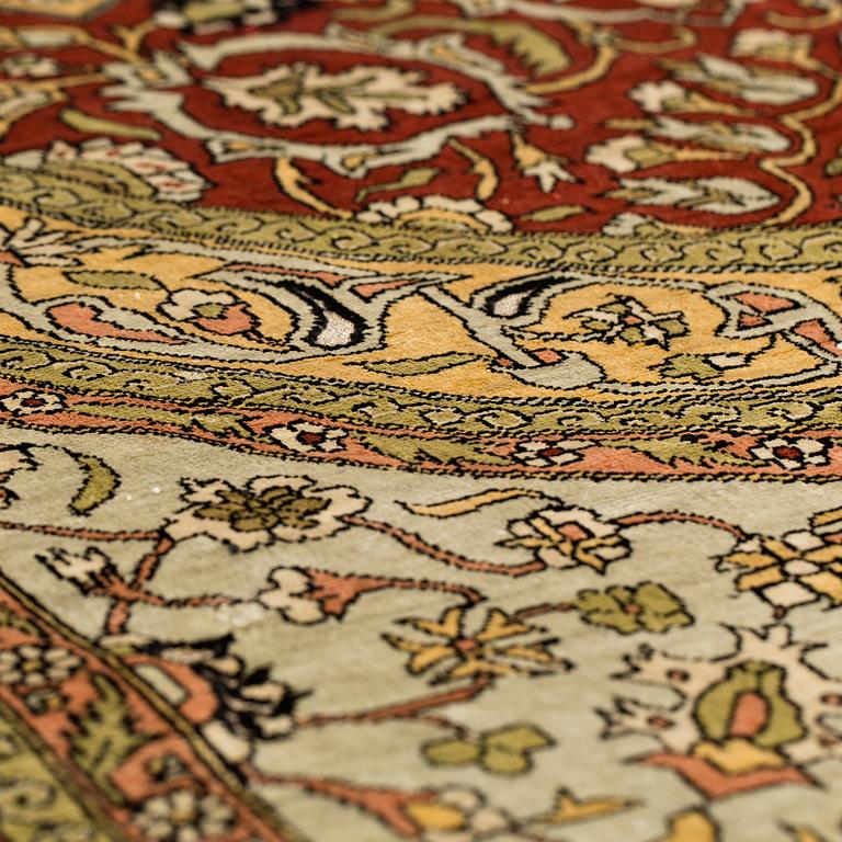 A RUG. An old silk Hereke Souf, 172 x 116 cm.