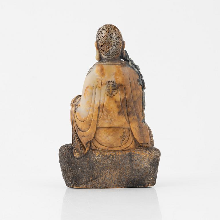A soapstone sculpture of a lohan, late Qing dynasty.