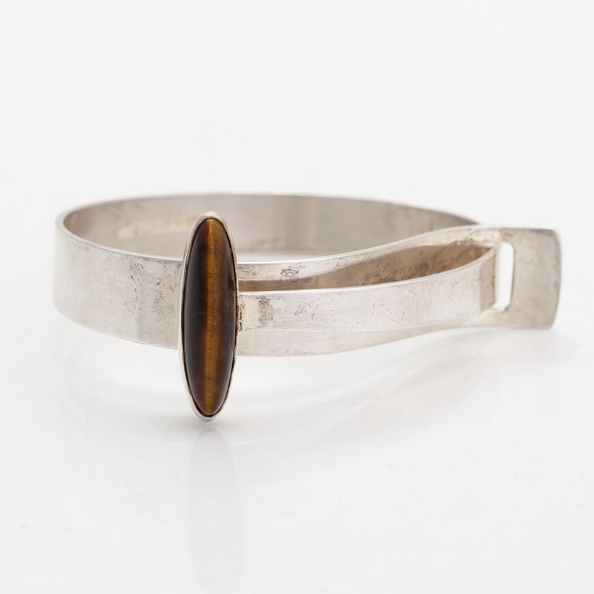 Elis Kauppi, A sterling silver bracelet with a tiger eye. Kupittaan Kulta, Turku 1961.