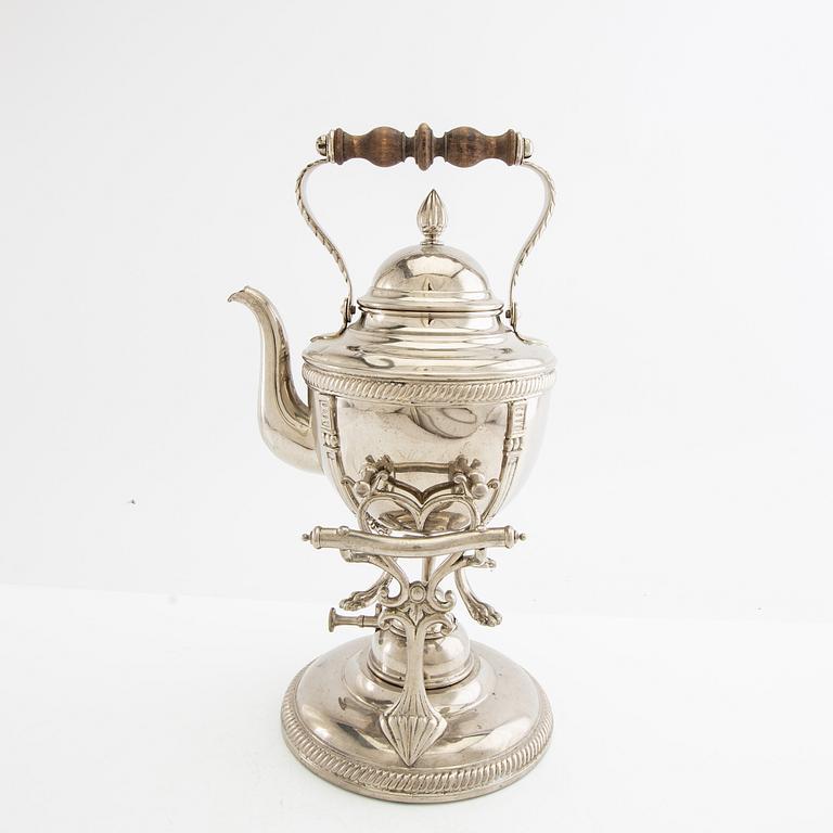 Tea kettle with a burner around 1900.