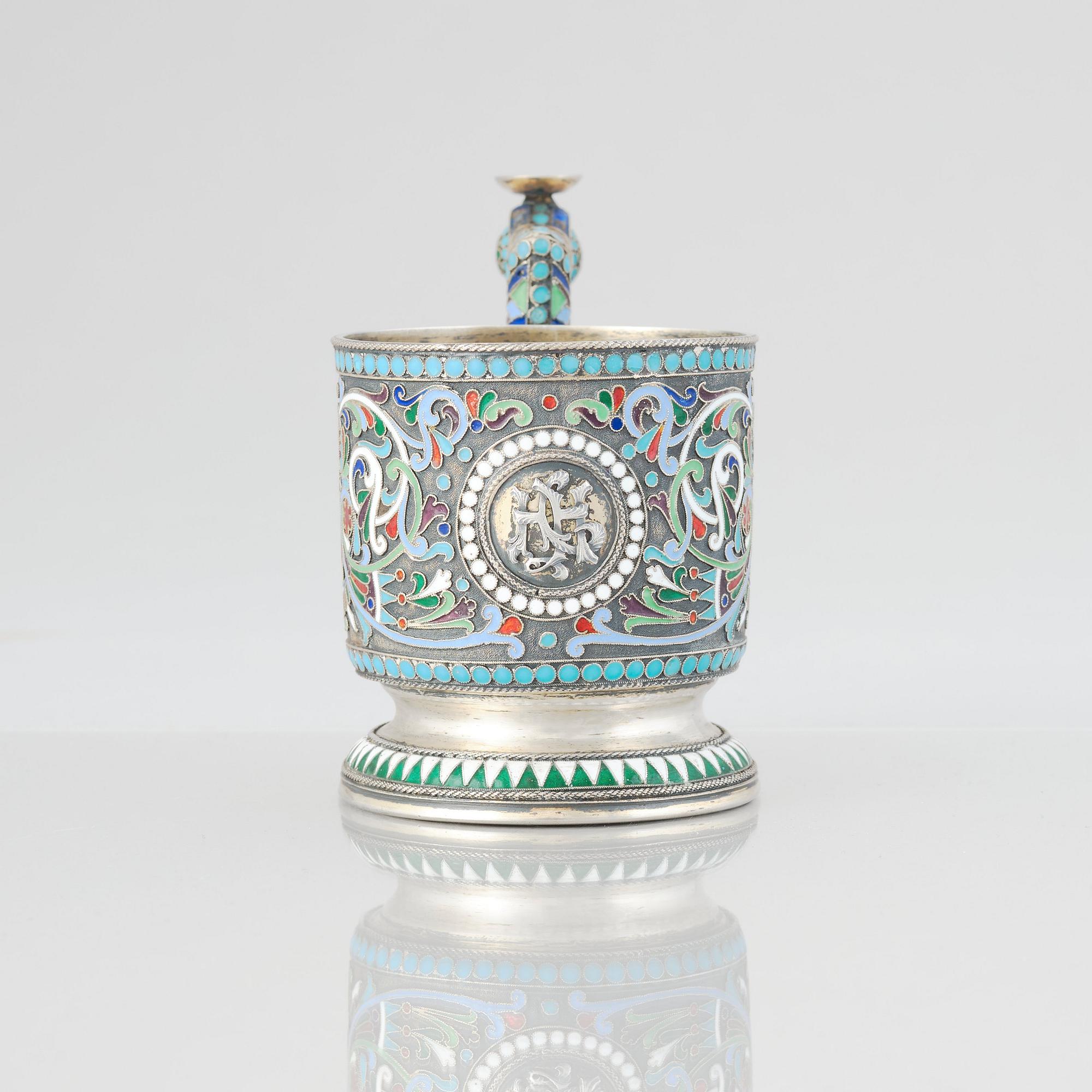 A Russian 19th Century silver-gilt and enamel tea-glass holder, unidentified makers mark, Moscow before 1899.