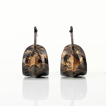 A pair of Japanese lacquered stirrups, Meiji period (1868-1912).