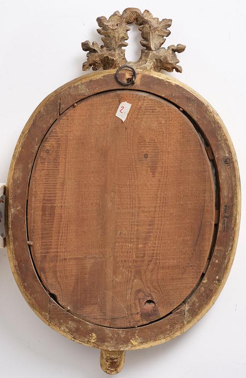 A pair of Gustavian giltwood two-branch girandole mirrors by J. Åkerblad (master in Stockholm 1758-99).