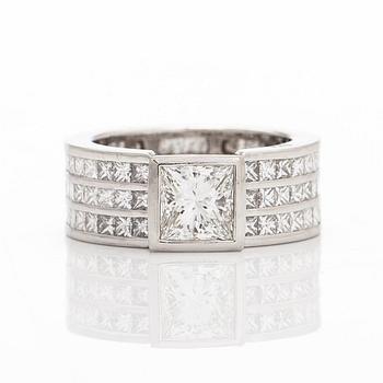 A platinum ring set with princess-cut diamonds, total approximately 4.21 ct.
