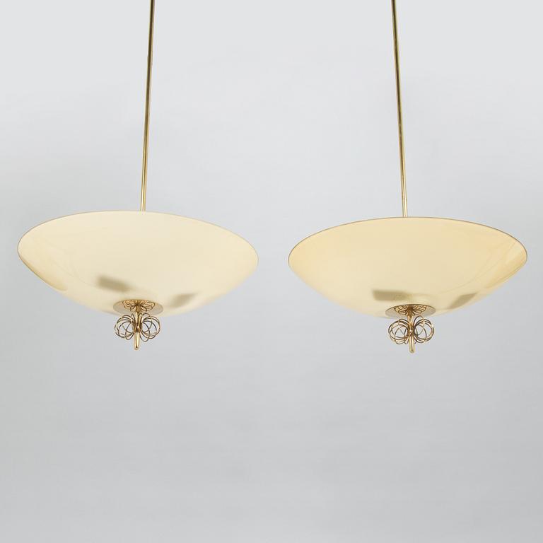 Paavo Tynell, a pair of mid-20th century pendant lights for Idman.