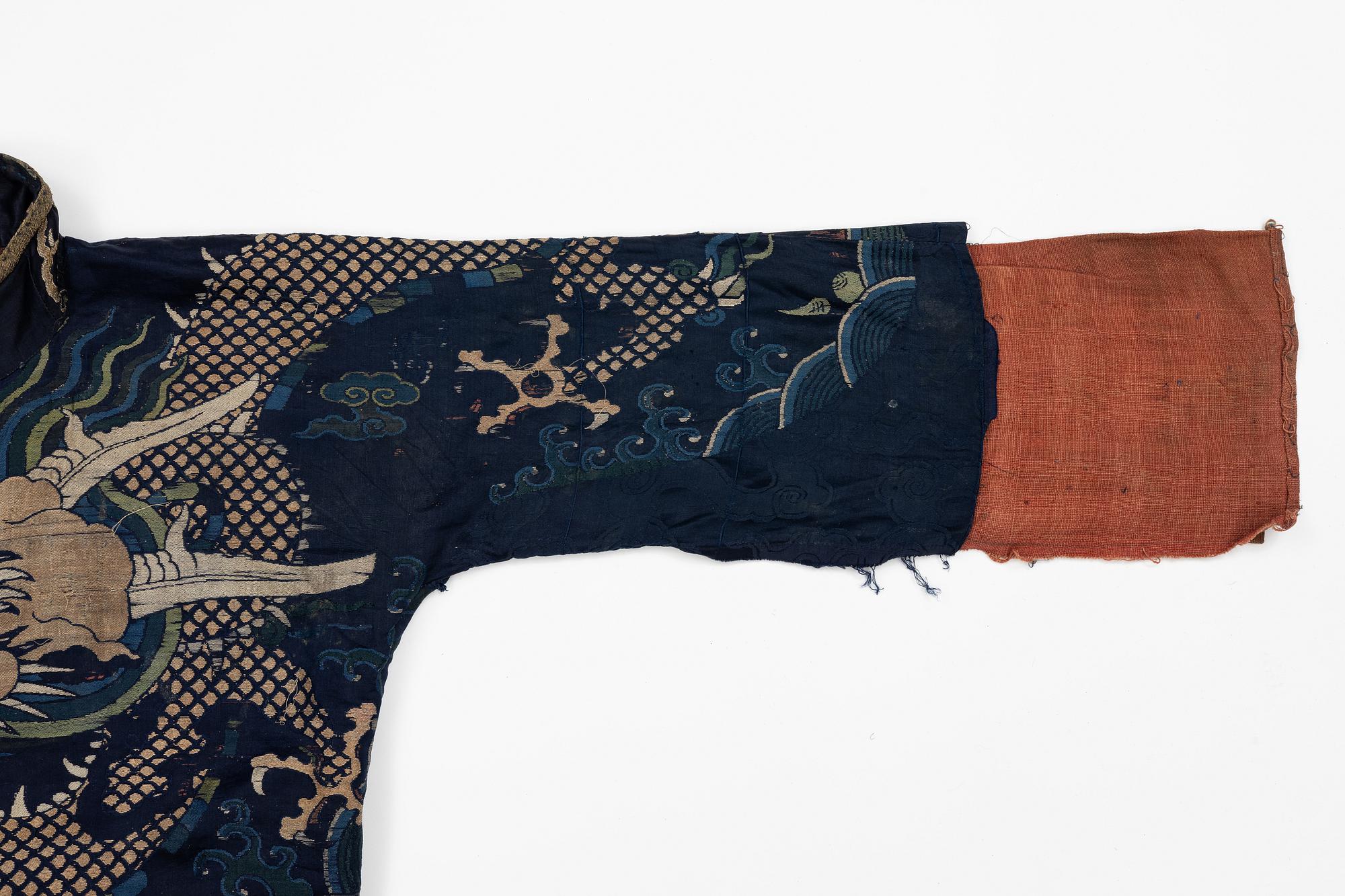 A rare fragment of a silk four clawed 'dragon' jacket, late Ming dynasty/early Qing dynasty.