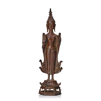 1001. A standing sculpture of buddha, Laos, 18th Century.