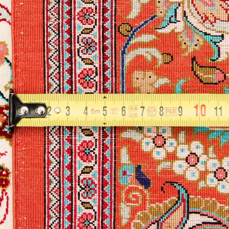 A signed Qum silk rug, old, 193x130 cm.