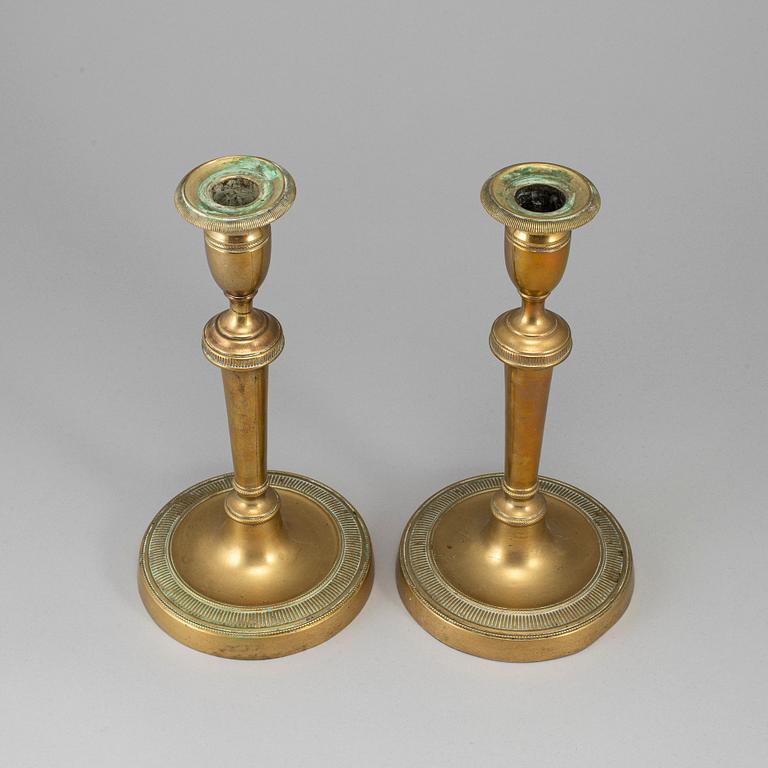 A pair of late 18th century bronze candlesticks.