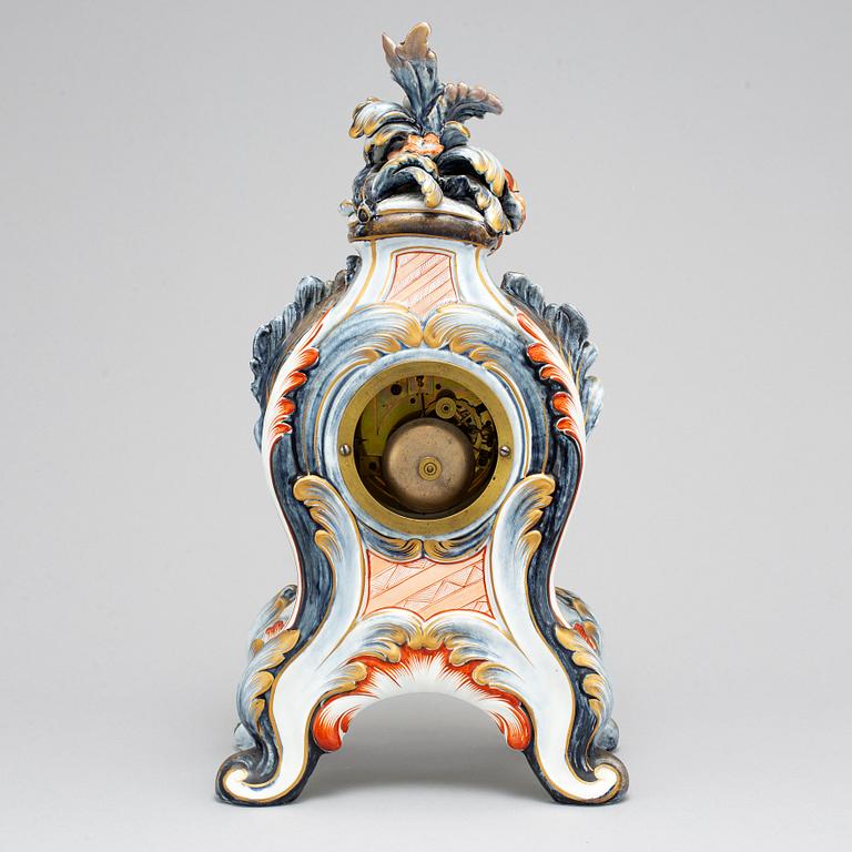 A new rococo creamware bracket clock, after Meissen model, early 20th century.